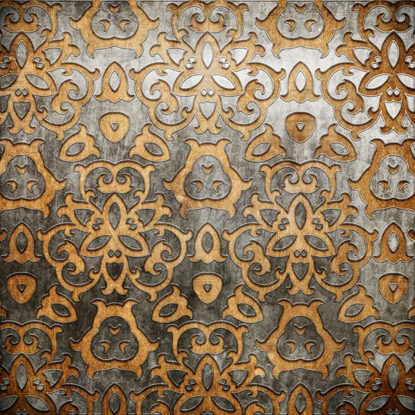 Ornamento de metal no fundo de madeira velha — Fotografia de Stock