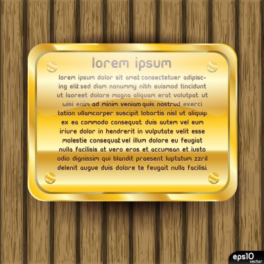 ahşap zemin üzerine altın plaka