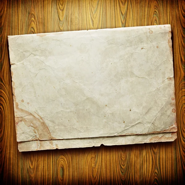 Vintage papperskort på trä textur — Stockfoto