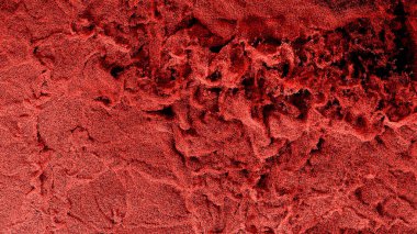 Milyonlarca küçük kırmızı parçacık, ekranı bir sürü girdap ve küçük dalgalarla dolduruyor.