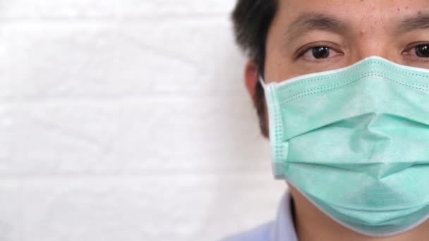 Closeup man waring sugical mask — Stock video