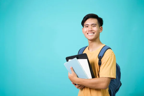 Confident student young man holding books. — Stock Photo, Image