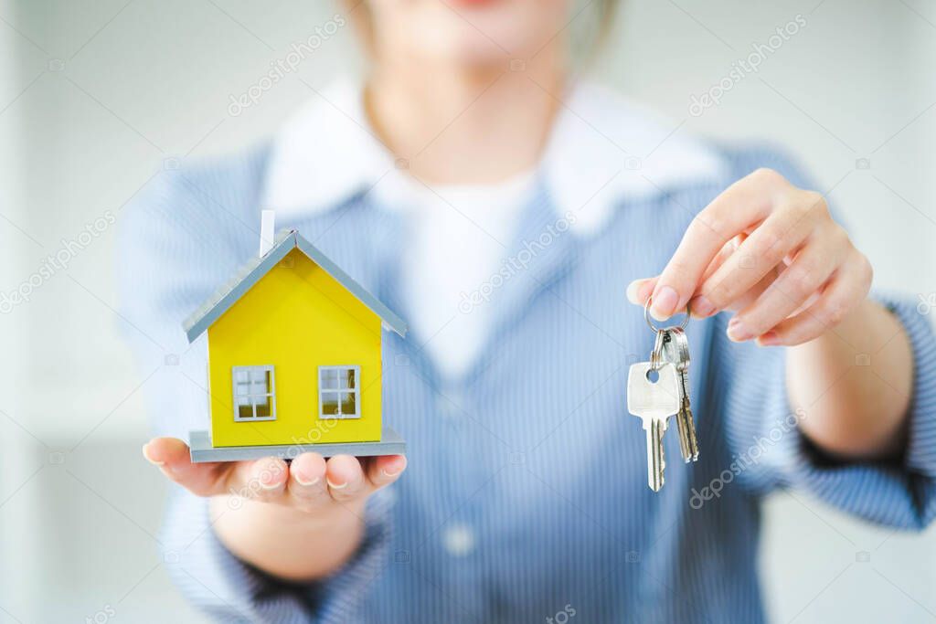 Businesswoman Holding House Keys.