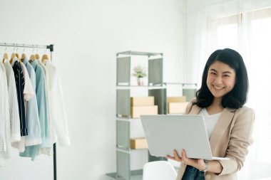 Business owner Young asian women happy after receive new order from customer. Online Business Ideas and Freelance.