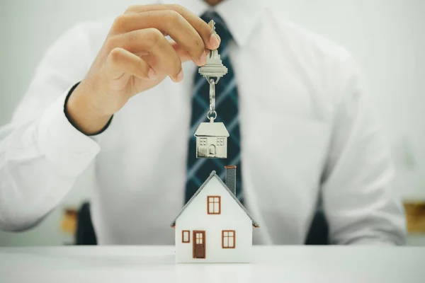 Businessman Holding House Model House Keys — Stock Photo, Image