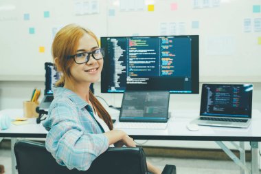 Close up Programmer is coding and programming software. business woman working on computer in the office.