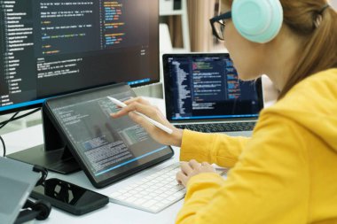 Close up Programmer is coding and programming software. business woman working on computer in the office.