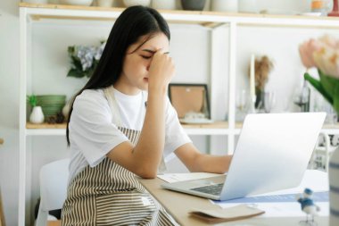 Stressed overwork businesswoman in the office.