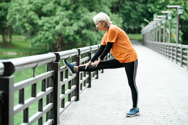 Athletic Senior Woman Jogger Warming Stretching Leg Upper Body Running — Fotografia de Stock