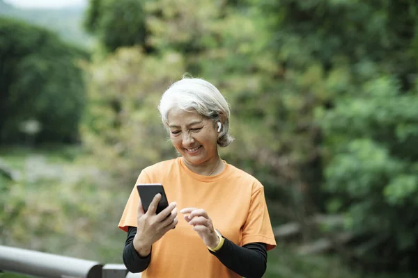 Happy Senior Woman Taking Selfie Photo While Running Park Concept — Stok fotoğraf