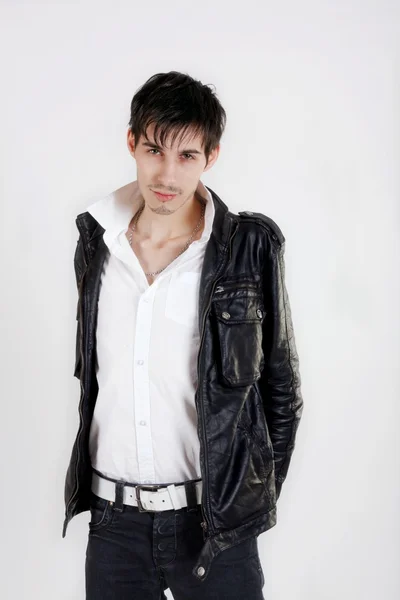 Attractive young man in black leather jacket Stock Photo