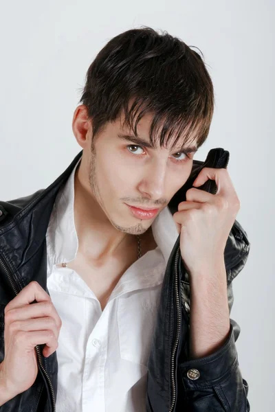 Attractive young man in black leather jacket Stock Picture