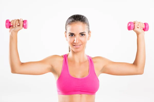 Fitness woman lifting dumbbells — Stock Photo, Image