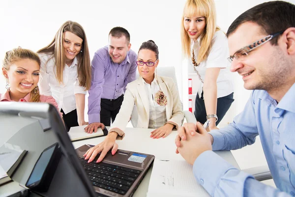 Businesspeople looking at laptop. — Stock Photo, Image