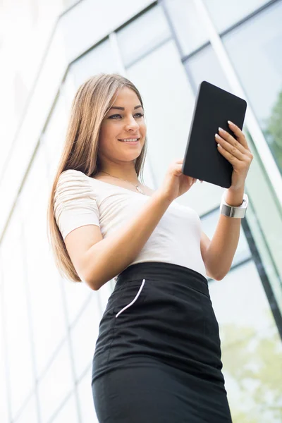 Businesswoman using a Tablet PC outoors