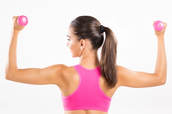 Fitness woman lifting dumbbells — Stock Photo, Image