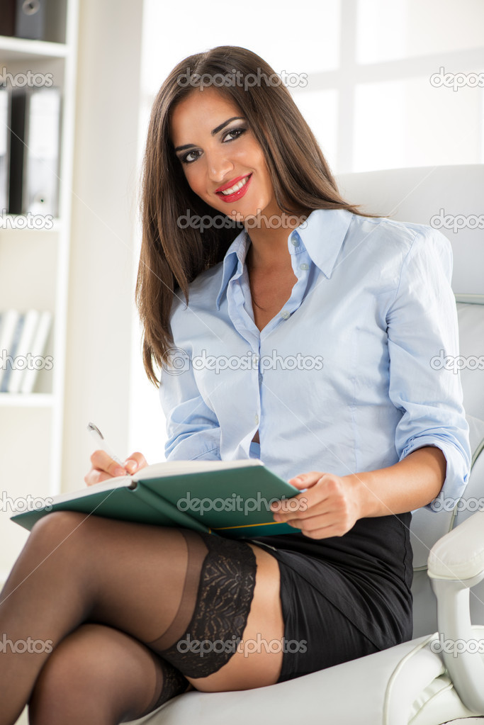 Sexy business woman posing stock photo