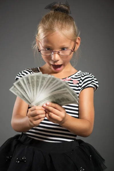 Little girl with money — Stock Photo, Image