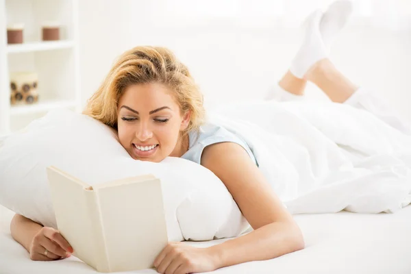 Woman resting in the bed Stock Image