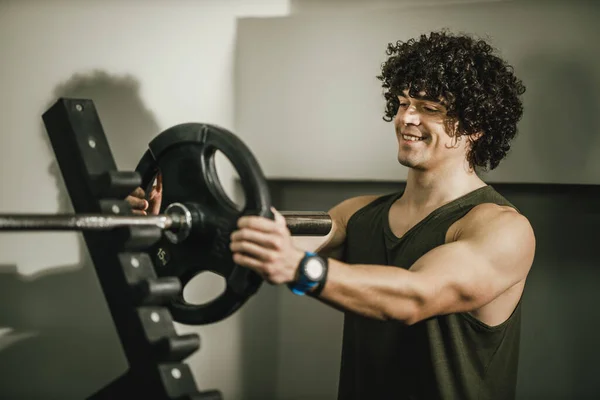 Muscular Guy Working Out Gym Putting More Weights Plate Barbell — Stock Photo, Image