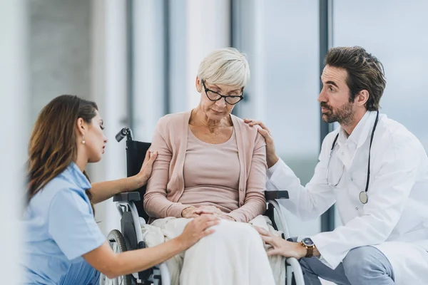 Successful Doctor Young Nurse Talking Senior Female Patient Wheelchair Hospital — 图库照片