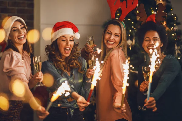 Four Cheerful Multiethnic Girls Having Fun Sparklers While Toasting Champagne — Stock Photo, Image