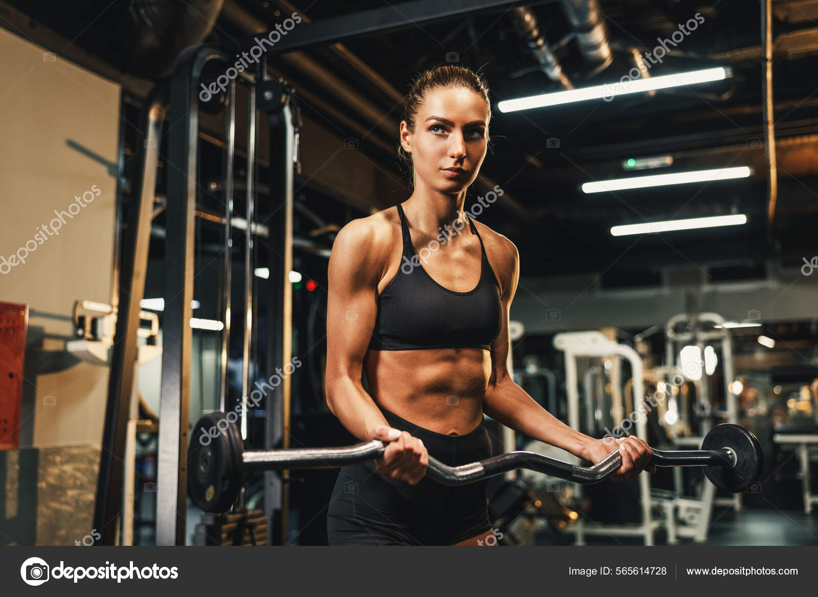 Premium Photo  A young muscular woman doing hard training for her