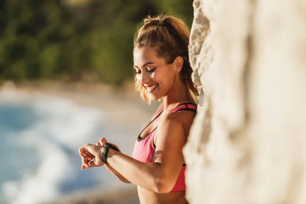Happy Young Woman Preparing Training Sea Beach Looking Her Smartwatch — Foto de Stock