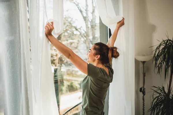 Young Woman Enjoying View Window Morning Sunshine Home — Stockfoto