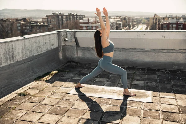 Relaxed Young Woman Doing Yoga Stretching Exercise Rooftop Terrace City — Stok fotoğraf