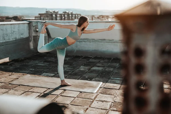 Female Teenager Practicing Yoga Rooftop Terrace — стоковое фото