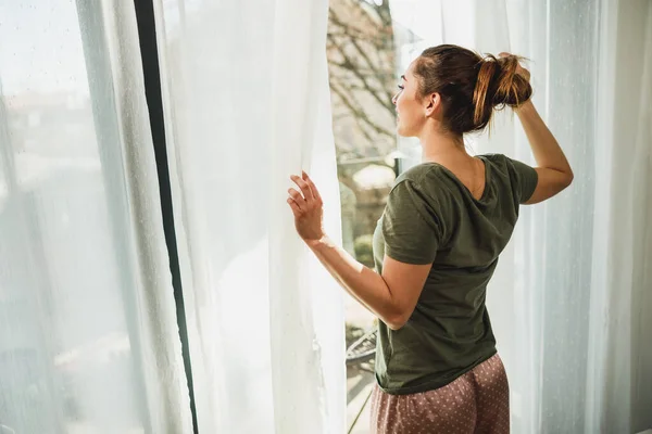 Young Woman Enjoying View Window Morning Sunshine Home Hotel Room — Foto de Stock