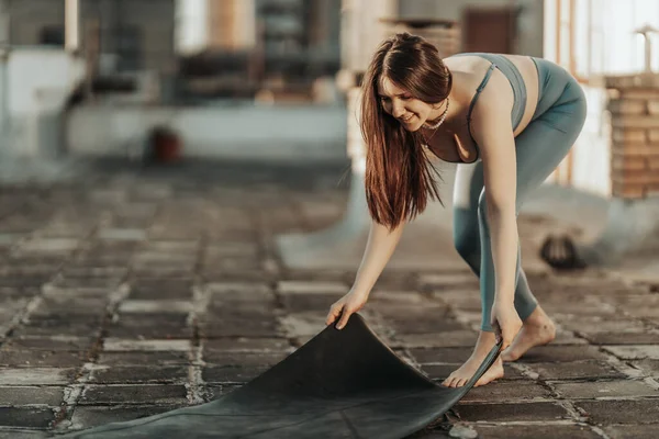 Relaxed Woman Preparing Exercise Mat Practicing Yoga Rooftop Terrace — Stockfoto