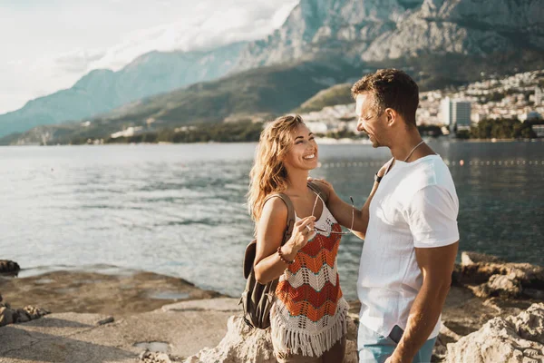 Happy casual couple having fun while enjoying a summer vacation at the Mediterranean.