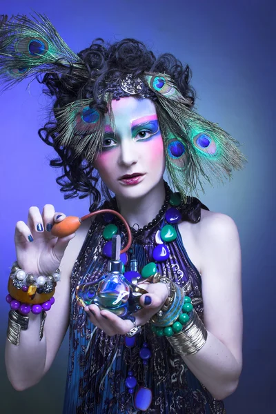 Woman in peacock image. — Stock Photo, Image