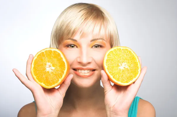 Woman with oranges — Stock Photo, Image