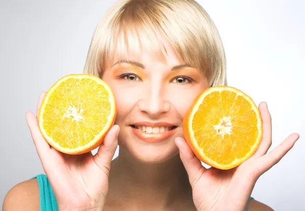 Woman with oranges — Stock Photo, Image