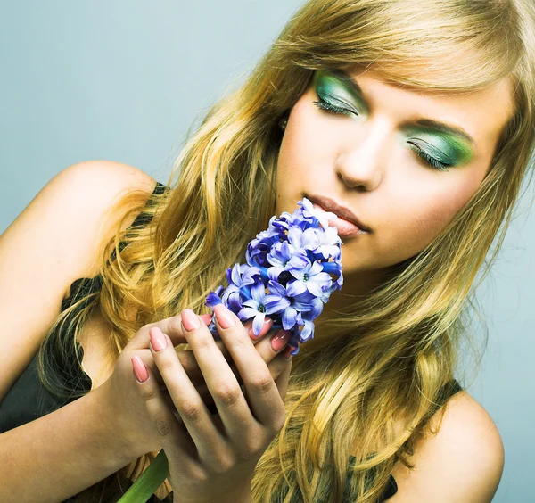 Girl with blue flower — Stock Photo, Image