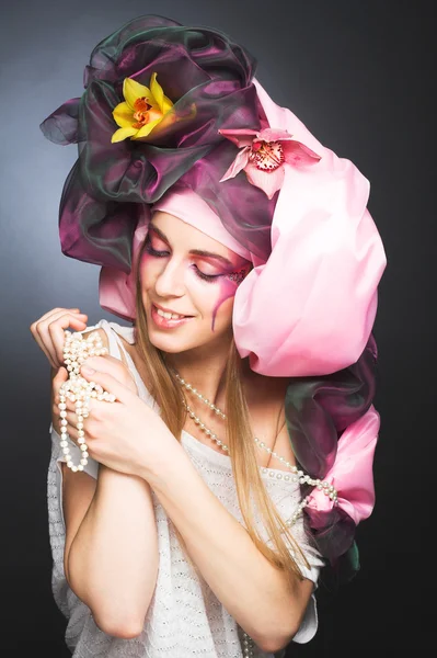 Young lady with orchids — Stock Photo, Image