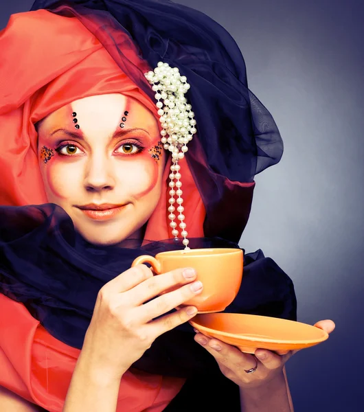 Young woman in black and orange turban — Stock Photo, Image