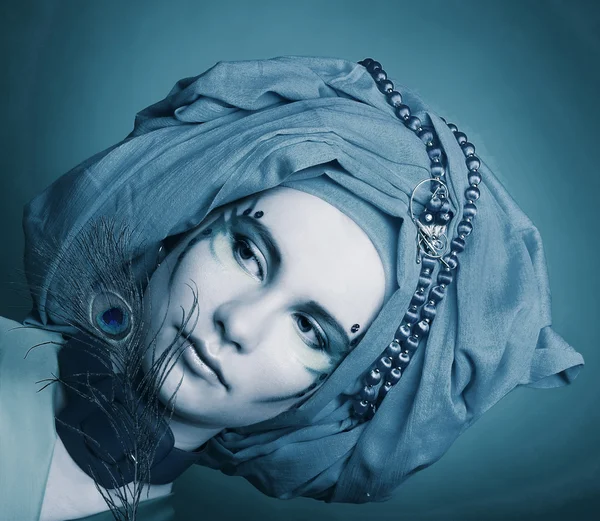 Young woman with peacock feathers — Stock Photo, Image