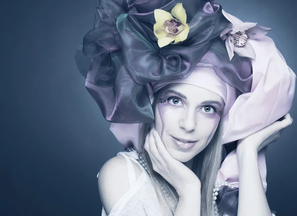 Young lady with orchids — Stock Photo, Image