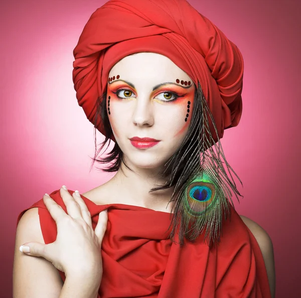 Woman in red turban — Stock Photo, Image