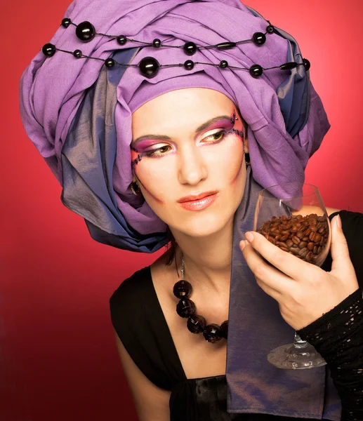 Young woman in violet turban — Stock Photo, Image