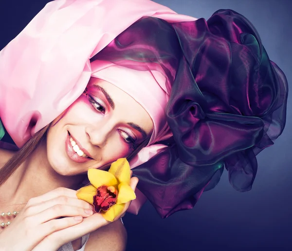 Young lady with orchids — Stock Photo, Image