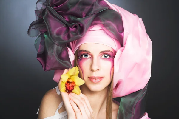 Young lady with orchids — Stock Photo, Image