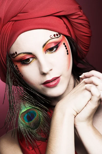 Woman in red turban — Stock Photo, Image