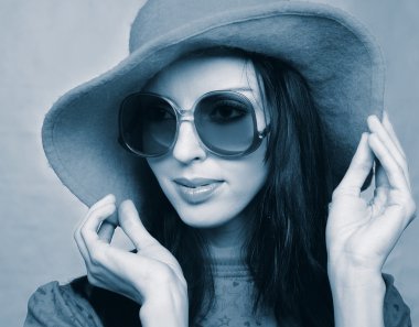 Vintage woman in sunglasses and  hat clipart