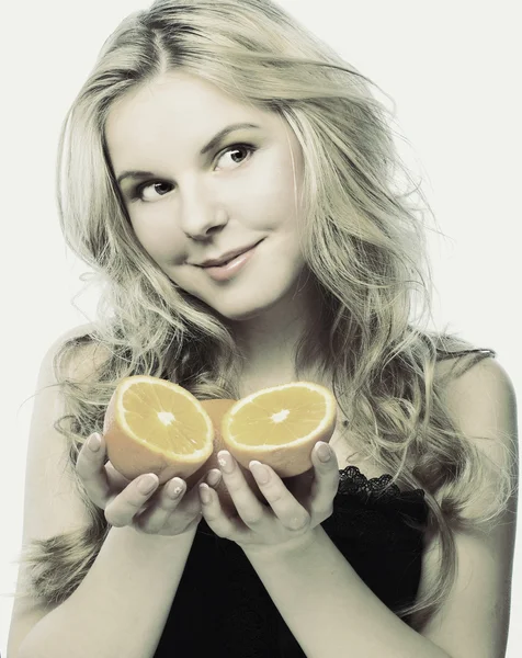 Young girl with orange — Stock Photo, Image