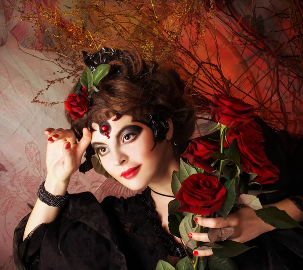 Woman with roses and skull — Stock Photo, Image